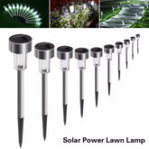Close-up of solar garden lights with a warm glow on a patio
